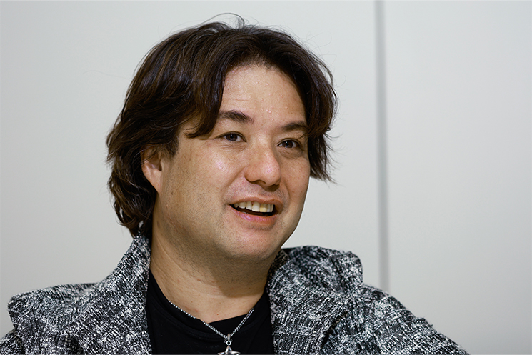 アメリカにおけるAI活用の契約に関して、日本とは異なり成果主義で締結が結ばれることについて解説するブランドンさん